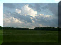 w clouds over field.jpg (16970 bytes)