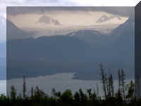 w a k 4 homer glacier 2 peaks clouds in.jpg (18930 bytes)